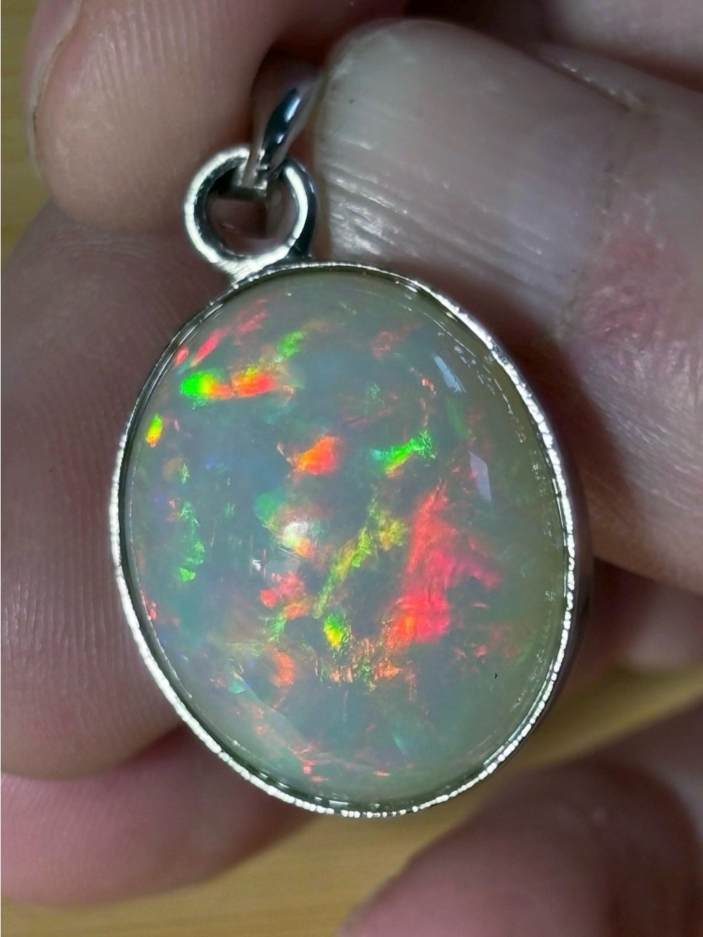 A 17.28ct AAA grade Ethiopian opal pendant with multi-patterned fire!